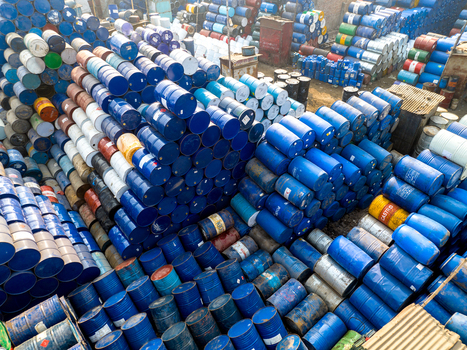 Aerial view of thousands of colorful metal oil drums and chemical barrels stacked in an industrial storage yard Dhaka Dhaka Division Bangladesh. Aerial view of thousands of colorful metal oil drums and chemical barrels stacked in an industrial storage yard Dhaka Dhaka Division Bangladesh.