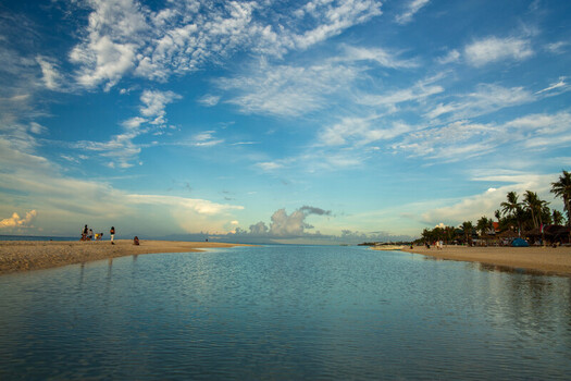 Cebu Central Visayas Philippines 21 June 2026 View of Bantayan Island beach with calm water white sand palm trees and people relaxing under a blue sky with clouds. Cebu Central Visayas Philippines 21 June 2026 View of Bantayan Island beach with calm water white sand palm trees and people relaxing under a blue sky with clouds.