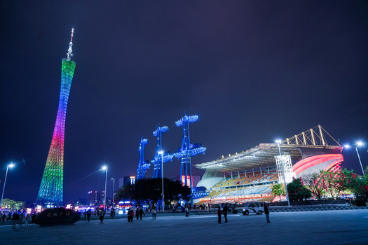 Guangzhou Guangdong Province China 23 February 2024 View of the illuminated Canton Tower and modern stadium architecture at night. Guangzhou Guangdong Province China 23 February 2024 View of the illuminated Canton Tower and modern stadium architecture at night.