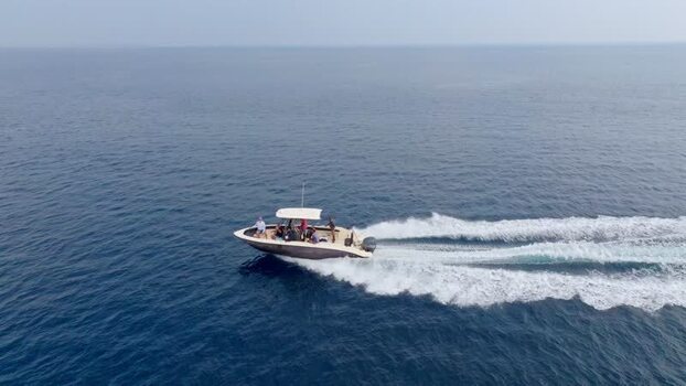 Aerial view of people on boat Maldives.