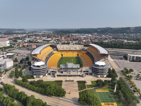 Pittsburgh Pennsylvania United States 26 July 2026 Aerial view of Acrisure Stadium with its distinctive yellow seating green field and surrounding urban landscape.