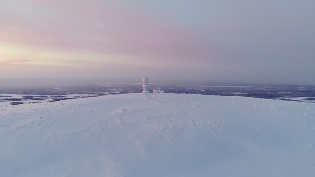 Aerial view of Luosto weather radar on a snowy peak Finland. Aerial view of Luosto weather radar on a snowy peak Finland.