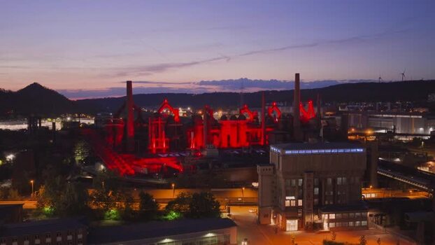 Aerial view of Volklingen Ironworks illuminated at dusk Germany. Aerial view of Volklingen Ironworks illuminated at dusk Germany.