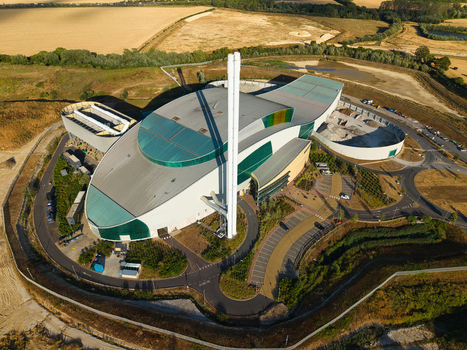 Aerial view of the Energy Recovery Facility in Bicester featuring a prominent tall chimney modern curved architecture and surrounding industrial grounds Bicester England United Kingdom.