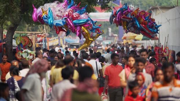 View of a crowded street with colorful balloons in Bangladesh.