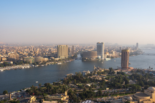 Cairo Egypt 19 October 2025 View of the tranquil Nile River winding through the city with gleaming skyscrapers reflecting the soft morning light. Cairo Egypt 19 October 2025 View of the tranquil Nile River winding through the city with gleaming skyscrapers reflecting the soft morning light.