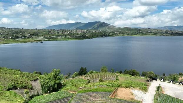 Aerial view of Alahan Panjang lake and green hills Indonesia. Aerial view of Alahan Panjang lake and green hills Indonesia.