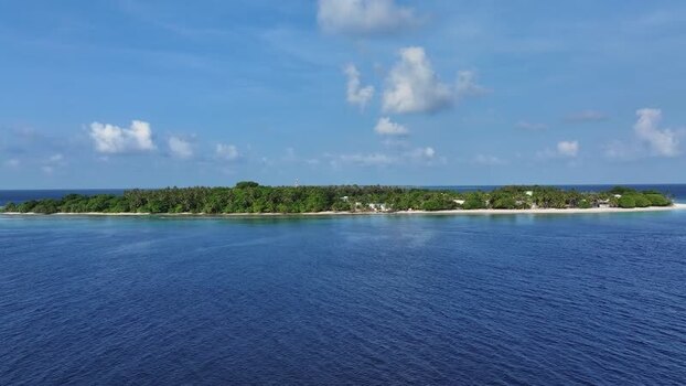 Aerial view of a tropical island with lush palm trees and blue ocean Maldives. Aerial view of a tropical island with lush palm trees and blue ocean Maldives.