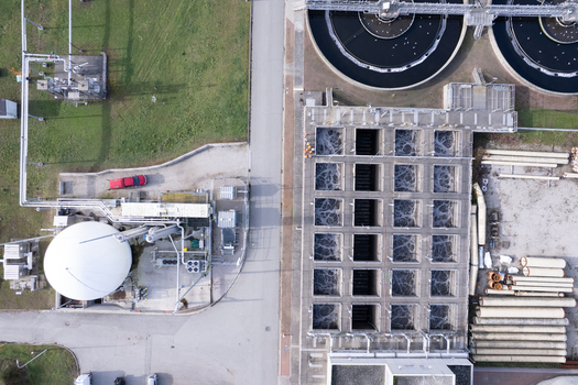 Aerial view of the Waste Water Treatment plant featuring aeration basins and circular tanks in Richmond British Columbia Canada. Aerial view of the Waste Water Treatment plant featuring aeration basins and circular tanks in Richmond British Columbia Canada.