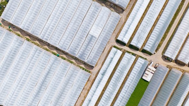 Aerial view of greenhouses for growing vegetables in San Giuliano Milanese Lombardy Italy. Aerial view of greenhouses for growing vegetables in San Giuliano Milanese Lombardy Italy.