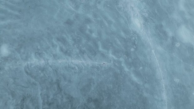 Aerial view of frozen lake patterns Norway.