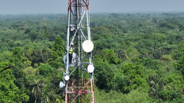 Aerial view of a technician on a cell tower Bangladesh.