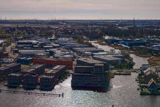 Wormerveer Netherlands 15 May 2026 Aerial view of the former De Pijl factory awaiting redevelopment surrounded by modern residential islands and industrial buildings. Wormerveer Netherlands 15 May 2026 Aerial view of the former De Pijl factory awaiting redevelopment surrounded by modern residential islands and industrial buildings.