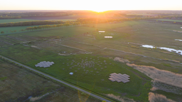 Aerial view of the LOFAR superterp radio telescope antenna arrays in a green field during sunset Buinen Drenthe Netherlands. Aerial view of the LOFAR superterp radio telescope antenna arrays in a green field during sunset Buinen Drenthe Netherlands.