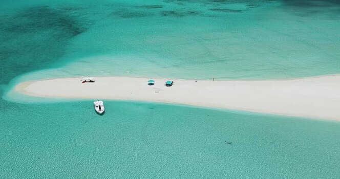 Aerial view of a white sandbar and boat in Dhidhdhoo Maldives. Aerial view of a white sandbar and boat in Dhidhdhoo Maldives.