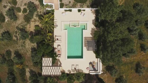 Aerial view of a modern swimming pool and terrace Spain.