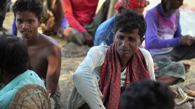 View of men sitting together in Natore Bangladesh. View of men sitting together in Natore Bangladesh.