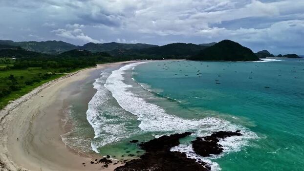 Aerial view of beach and rocky coastline in Bali Indonesia.