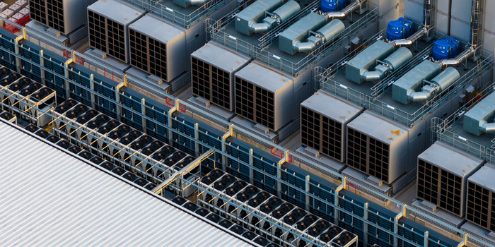 Aerial view of the Kao Data facility featuring rows of industrial cooling units and ventilation systems on the rooftop in Harlow England United Kingdom. Aerial view of the Kao Data facility featuring rows of industrial cooling units and ventilation systems on the rooftop in Harlow England United Kingdom.
