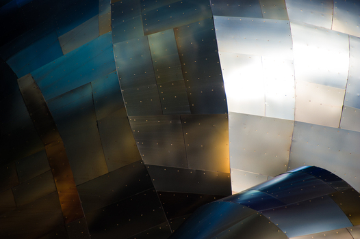 View of the metallic curved and riveted exterior panels of the Museum of Pop Culture in Seattle Washington United States.