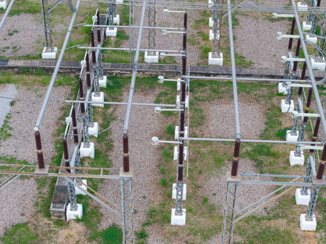 Aerial view of a high voltage main inlet substation in the Tenaga Nasional Berhad transmission grid featuring metal structures and electrical insulators in Central Seberang Perai Penang Malaysia. Aerial view of a high voltage main inlet substation in the Tenaga Nasional Berhad transmission grid featuring metal structures and electrical insulators in Central Seberang Perai Penang Malaysia.