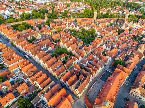 Aerial view of the historic town with its iconic red tiled rooftops medieval fortifications and narrow streets in Rothenburg ob der Tauber Bavaria Germany. Aerial view of the historic town with its iconic red tiled rooftops medieval fortifications and narrow streets in Rothenburg ob der Tauber Bavaria Germany.