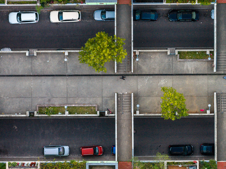 Aerial view of the High Deck Siedlung residential complex with cars parked along streets pedestrian walkways and green trees in Berlin Berlin Germany. Aerial view of the High Deck Siedlung residential complex with cars parked along streets pedestrian walkways and green trees in Berlin Berlin Germany.