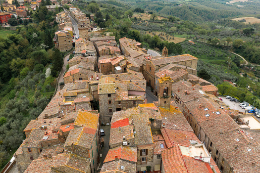 Aerial view of medieval stone buildings with terracotta roofs and a bell tower in the historic center of Ficulle Umbria Italy. Aerial view of medieval stone buildings with terracotta roofs and a bell tower in the historic center of Ficulle Umbria Italy.