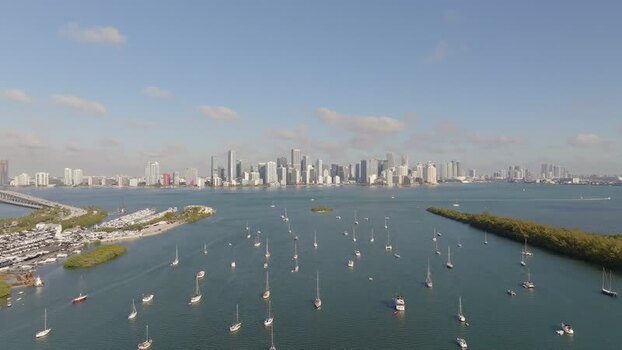 Aerial view of city skyline with boats in Biscayne Bay United States.