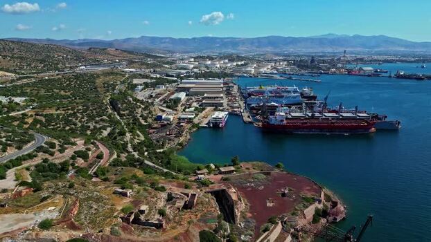 Aerial view of industrial port and ships in Greece.