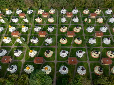Slagharen Netherlands 03 October 2023 Aerial view of the Wigwam Parc s unique spherical accommodations nestled amidst vibrant green lawns and bordered by lush dark green trees. Slagharen Netherlands 03 October 2023 Aerial view of the Wigwam Parc s unique spherical accommodations nestled amidst vibrant green lawns and bordered by lush dark green trees.