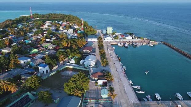 Aerial view of Vashafaru island village and harbor Maldives. Aerial view of Vashafaru island village and harbor Maldives.