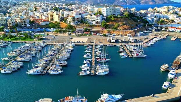 Aerial view of marina in Crete with yachts and boats Greece.