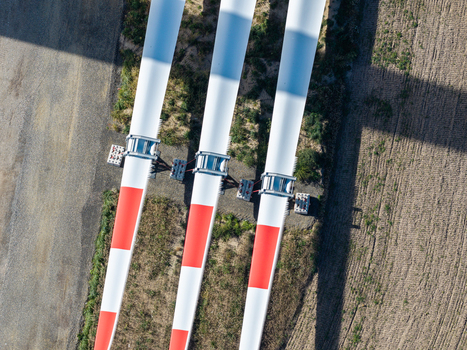 Aerial view of wind turbine blades lying on the ground at the Windpark Forst Briesnig II located on recultivated land of a former open pit mine in Forst Brandenburg Germany. Aerial view of wind turbine blades lying on the ground at the Windpark Forst Briesnig II located on recultivated land of a former open pit mine in Forst Brandenburg Germany.
