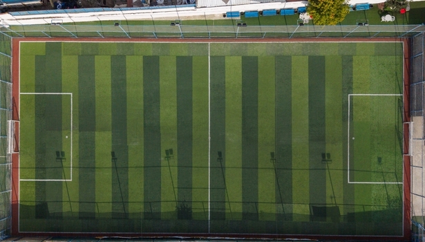 Aerial view of a soccer field with green artificial turf and white markings in Istanbul Istanbul Turkiye.