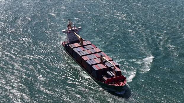 Aerial view of container ship sailing Portugal.