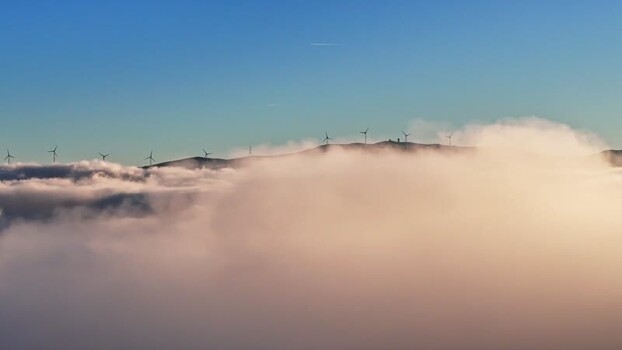 Aerial view of Windpark Freilanderalm 2 above clouds Austria. Aerial view of Windpark Freilanderalm 2 above clouds Austria.