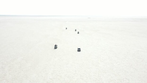 Aerial view of vehicles on the Danakil Desert salt flats Ethiopia. Aerial view of vehicles on the Danakil Desert salt flats Ethiopia.