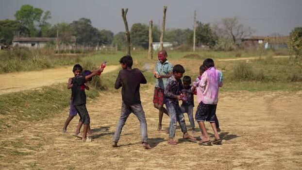 View of children playing with colored powder during Holi Nepal.
