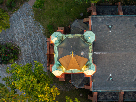Aerial view of Erloserkirche church with its green copper roof and central tower surrounded by trees and cobblestone paths in Berlin Berlin Germany. Aerial view of Erloserkirche church with its green copper roof and central tower surrounded by trees and cobblestone paths in Berlin Berlin Germany.