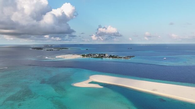 Aerial view of the tropical island of Gulhi and pristine sandbars Maldives. Aerial view of the tropical island of Gulhi and pristine sandbars Maldives.