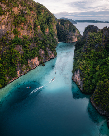 Aerial view of Pi Leh Bay with turquoise water and limestone cliffs in Tambon Ao Nang Chang Wat Krabi Thailand. Aerial view of Pi Leh Bay with turquoise water and limestone cliffs in Tambon Ao Nang Chang Wat Krabi Thailand.