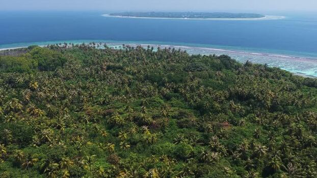 Aerial view of lush tropical island in Vaikaradhoo Maldives. Aerial view of lush tropical island in Vaikaradhoo Maldives.