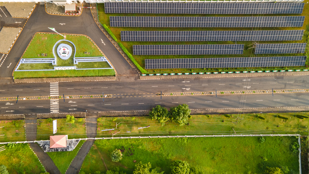 Aerial view of the Niger State Government House complex featuring rows of solar panels a paved road and landscaped green areas in Minna Niger Nigeria. Aerial view of the Niger State Government House complex featuring rows of solar panels a paved road and landscaped green areas in Minna Niger Nigeria.