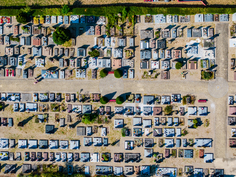 Aerial view of the cemetery with organized rows of gravestones stone pathways and small trees in Neuf Brisach Grand Est France.