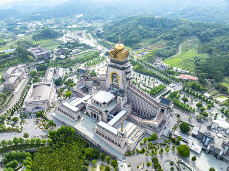Aerial view of the Chung Tai Chan Monastery a massive modern Buddhist temple with golden roofs and intricate architecture set amidst lush green hills in Puli Township Nantou County Taiwan. Aerial view of the Chung Tai Chan Monastery a massive modern Buddhist temple with golden roofs and intricate architecture set amidst lush green hills in Puli Township Nantou County Taiwan.