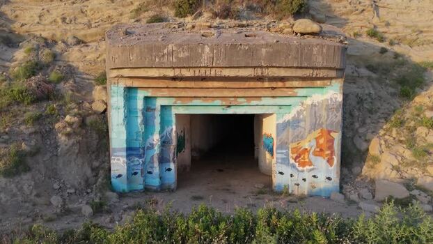 Aerial view of a concrete bunker with graffiti in Zvernec Albania. Aerial view of a concrete bunker with graffiti in Zvernec Albania.