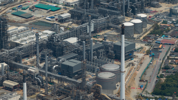 Aerial view of the Eastern Economic Corridor of Innovation EECi industrial complex with storage tanks chimneys and intricate piping systems in Tambon Pa Yup Nai Chang Wat Rayong Thailand. Aerial view of the Eastern Economic Corridor of Innovation EECi industrial complex with storage tanks chimneys and intricate piping systems in Tambon Pa Yup Nai Chang Wat Rayong Thailand.