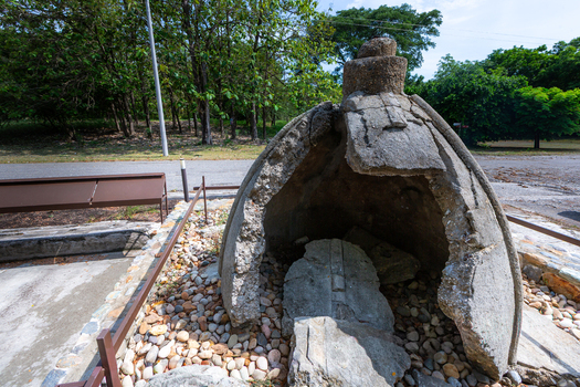 View of the remains of the church dome in Armero a site of the 1985 Nevado del Ruiz volcanic eruption surrounded by a memorial park with gravel paths in Armero Tolima Colombia.