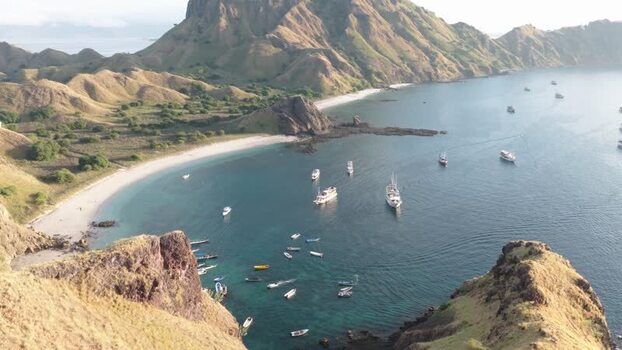 Aerial view of Padar Island with boats in the bay Indonesia.